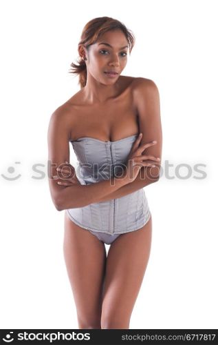 Beautiful young multiracial woman in a gray corset