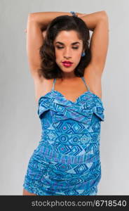 Beautiful young multiracial woman in a vintage swimsuit
