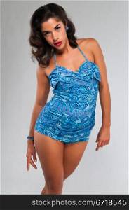 Beautiful young multiracial woman in a vintage swimsuit