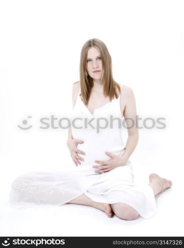 Beautiful Young Pregnant Woman In White Over White.