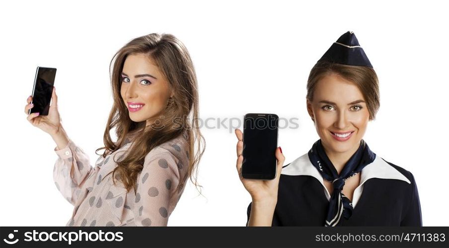 Beautiful young stewardess calling by phone isolated on white background