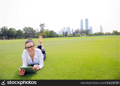 Beautiful young student woman study with tablet in park