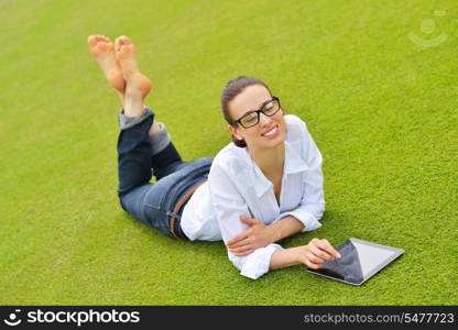 Beautiful young student woman study with tablet in park