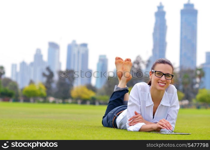 Beautiful young student woman study with tablet in park