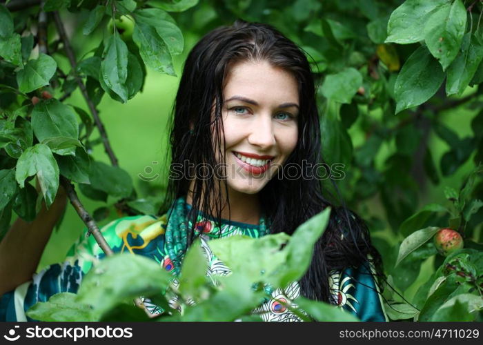 Beautiful young woman after the rain