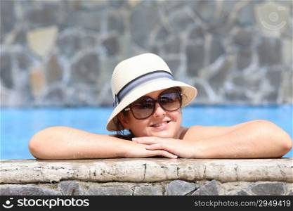 Beautiful young woman at a pool
