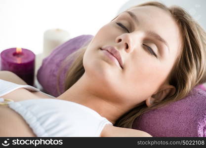 Beautiful young woman at a spa salon