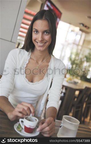 beautiful young woman at caffe break in restaurant