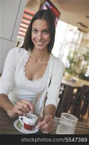 beautiful young woman at caffe break in restaurant