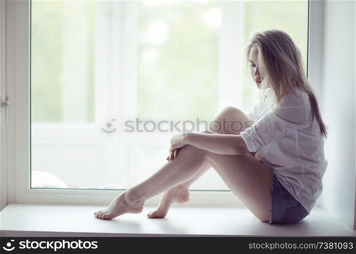 beautiful young woman at home in the apartment