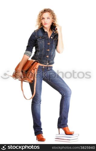Beautiful young woman blonde 20s standing full body in jeans shoulder bag isolated on white background Caucasian girl