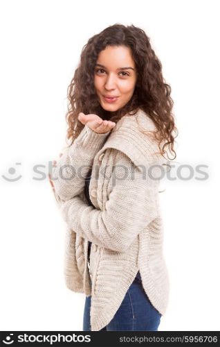 Beautiful young woman blowing you a kiss, isolated over white