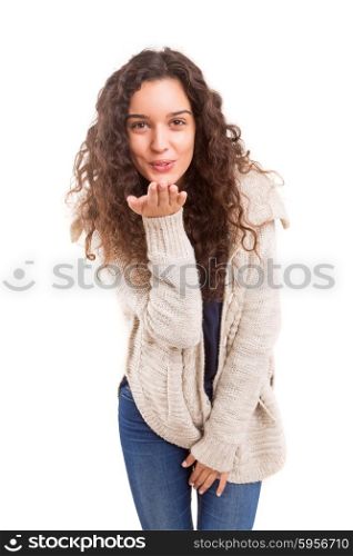 Beautiful young woman blowing you a kiss, isolated over white