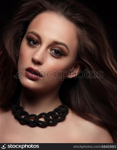 Beautiful young woman close-up portrait. Professional makeup.