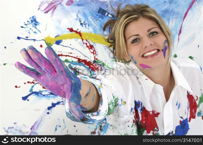 Beautiful Young Woman Covered in Paint. Shot in studio.