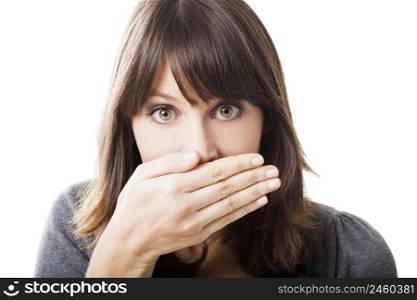 Beautiful young woman covering the face with her hand, isolated on a white background