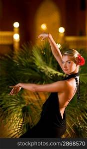 Beautiful young woman dancing