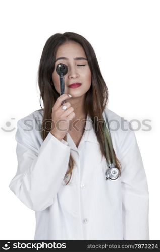 Beautiful young woman doctor holding an otoscope
