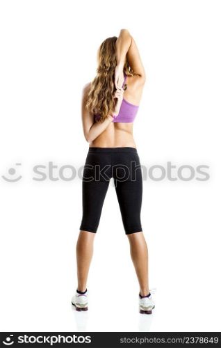 Beautiful young woman doing fitness exercises, isolate on white