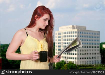 Beautiful young woman drinking coffee in the morning