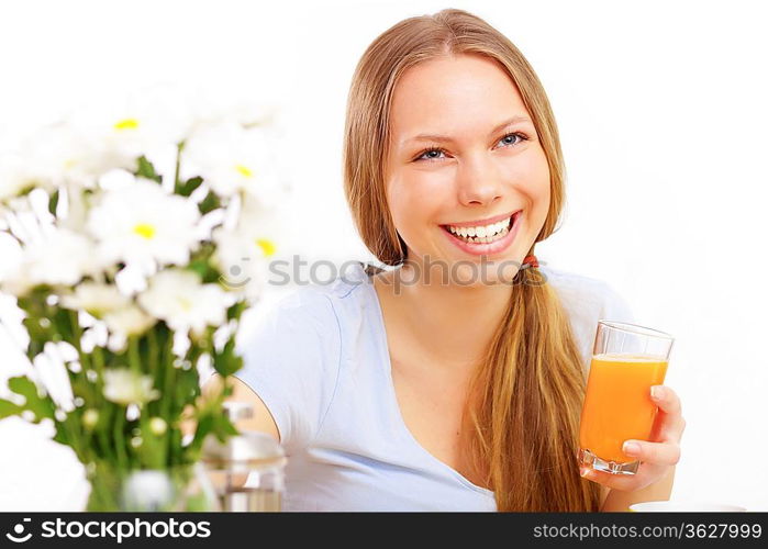 Beautiful young woman drinking tea from yellow cup