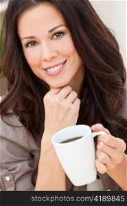 Beautiful Young Woman Drinking Tea or Coffee