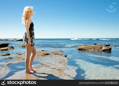 beautiful young woman enjoying summer vacation at the beach