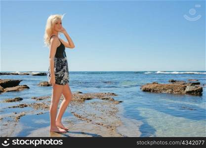 beautiful young woman enjoying summer vacation at the beach
