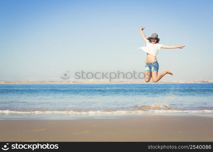 Beautiful young woman enjoying the beach