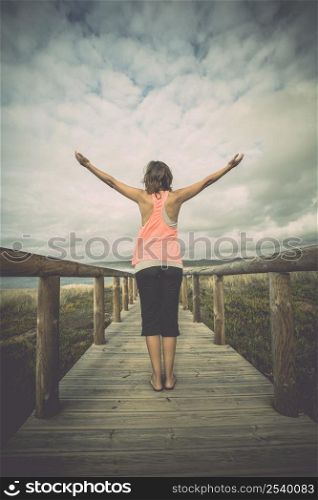 Beautiful young woman enjoying the freedom