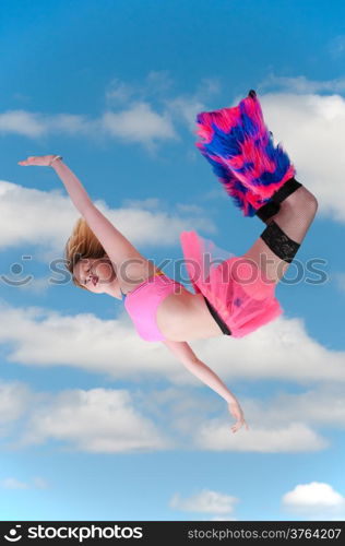 Beautiful young woman falling through the sky