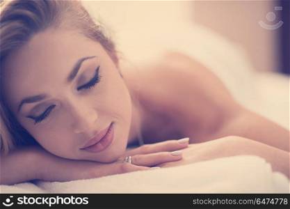 beautiful young woman getting back massage in spa and wellness salon. woman getting back massage in spa salon