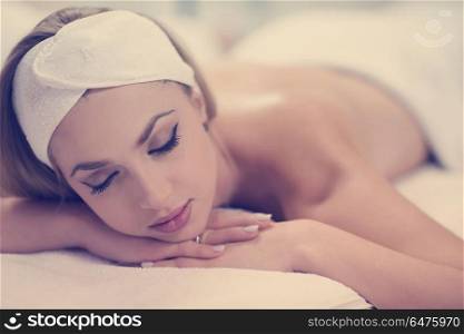 beautiful young woman getting back massage in spa and wellness salon. woman getting back massage in spa salon