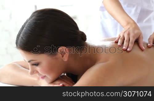 Beautiful young woman getting massage