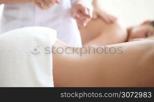 Beautiful young woman getting massage