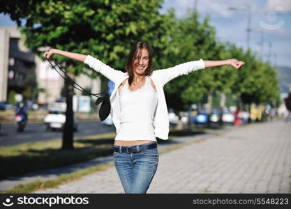 beautiful young woman have fun and relax at city street on beautiful sunny day