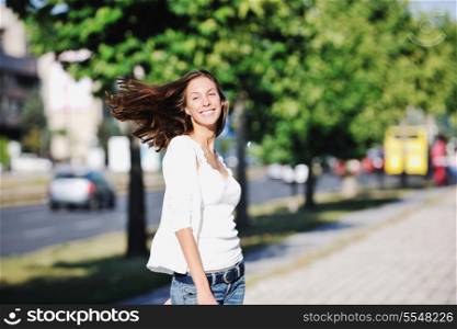 beautiful young woman have fun and relax at city street on beautiful sunny day