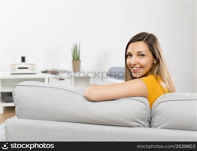 Beautiful young woman having a good time at home