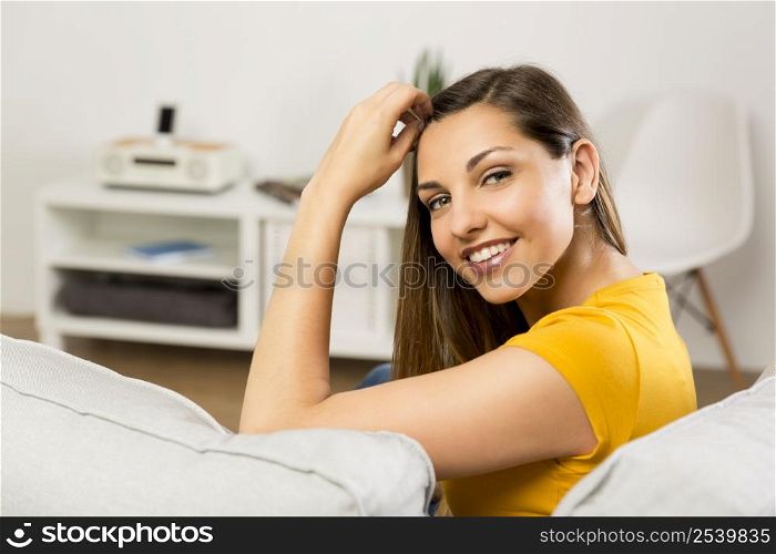 Beautiful young woman having a good time at home