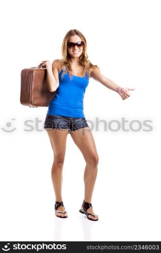 Beautiful young woman hitch hiking with old leather suitcase, isolated on white