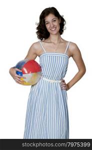 Beautiful young woman holding a beach ball