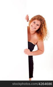 Beautiful young woman holding a blank white board