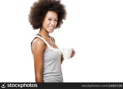 Beautiful young woman holding a cup of coffee, isolated on white