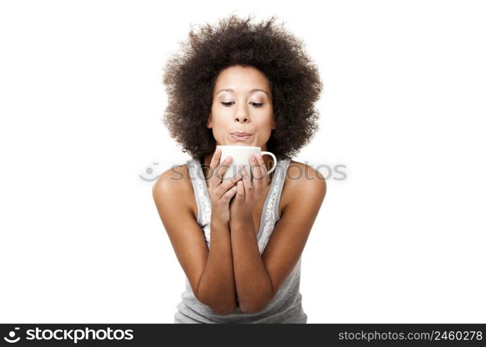 Beautiful young woman holding a cup of coffee, isolated on white