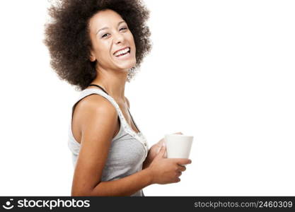 Beautiful young woman holding a cup of coffee, isolated on white
