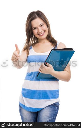 Beautiful young woman holding a folder and doing thumbs up, isolated over white background