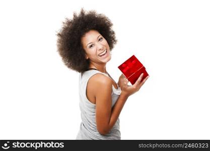 Beautiful young woman holding a gift, isolated on white