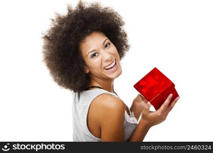 Beautiful young woman holding a gift, isolated on white
