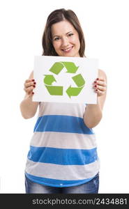 Beautiful young woman holding a paper card with the recycling symbol, isolated over white background