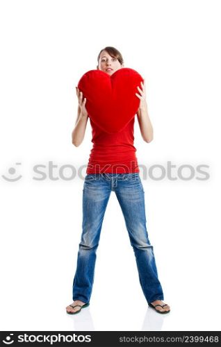 Beautiful young woman holding a red heart, Valentine concept